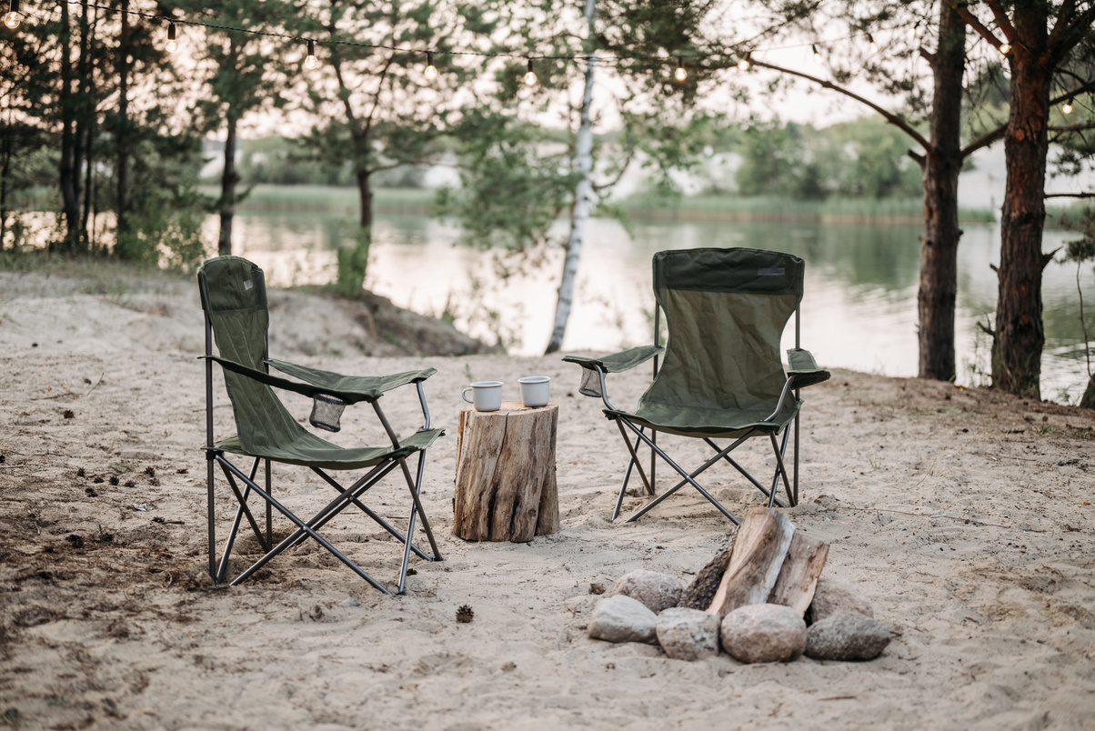 Black Camping Chairs on White Sand